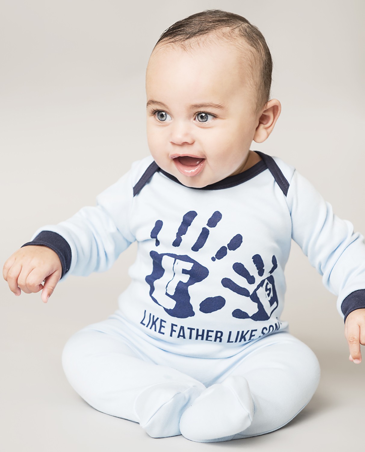 Cotton baby grow,sky blue with navy hands.